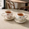 فنجان و نعلبکی سرامیکی گلریز، اثر دست‌ساز لیلا دهقانی، اصفهان، نقاشی با دست، ارتفاع ۸ سانتی‌متر، مناسب مایعات داغ